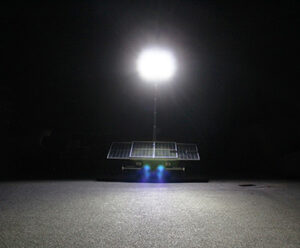 x solar lighting tower on road
